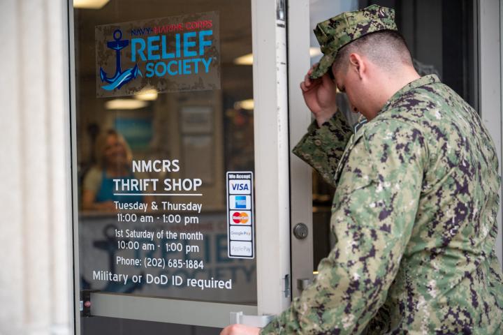 Sailor entering NMCRS thrift shop