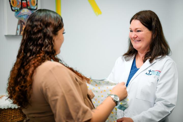 NMCRS Visiting Nurse talking with a patient